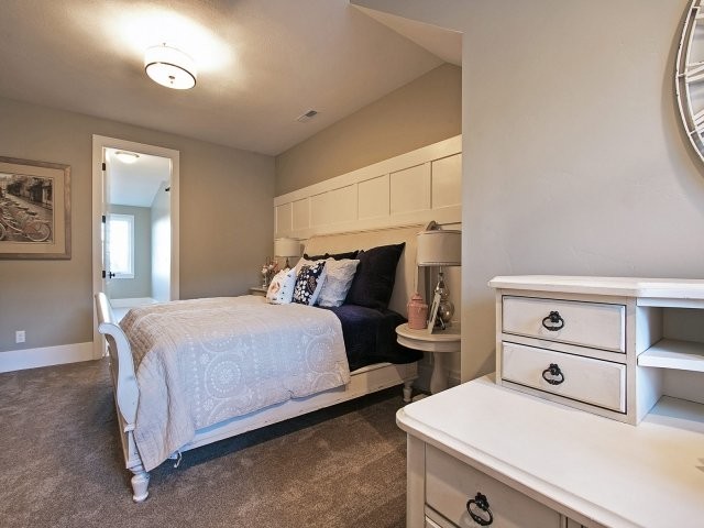 Medium sized traditional guest bedroom in Salt Lake City with grey walls, carpet and no fireplace.