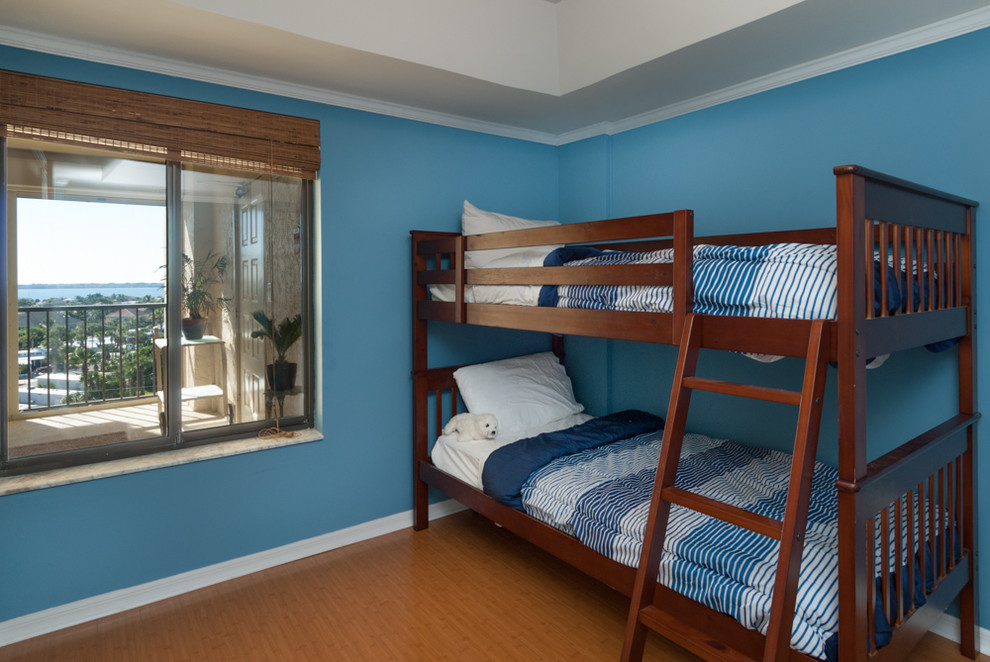 Example of a mid-sized classic guest dark wood floor and brown floor bedroom design in Other with blue walls and no fireplace