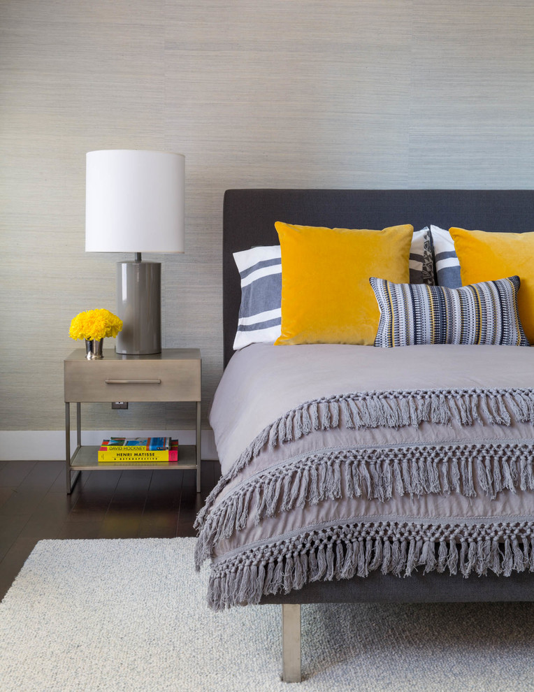 This is an example of a medium sized contemporary master, grey and yellow and grey and silver bedroom in San Francisco with grey walls, dark hardwood flooring and no fireplace.