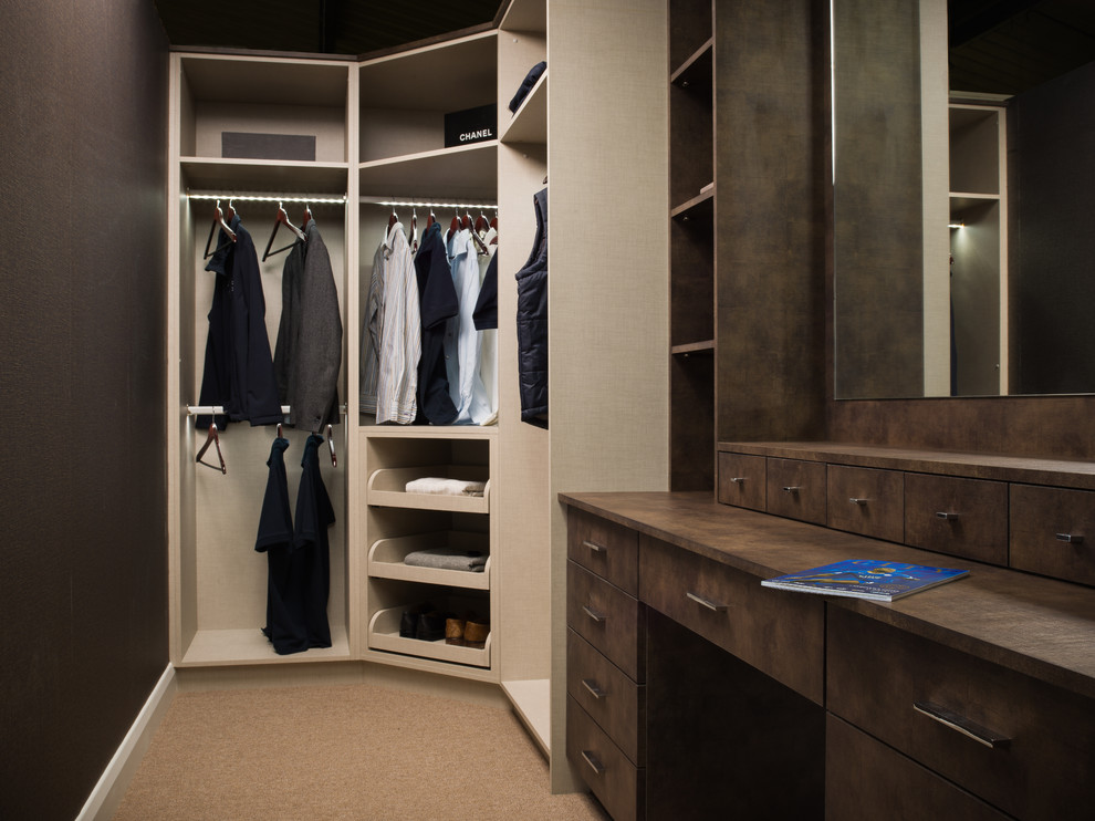 Inspiration for a small contemporary wardrobe in London with concrete flooring.