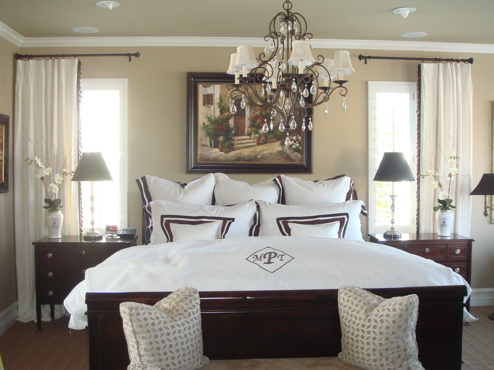 Contemporary master bedroom in Orange County with beige walls and carpet.