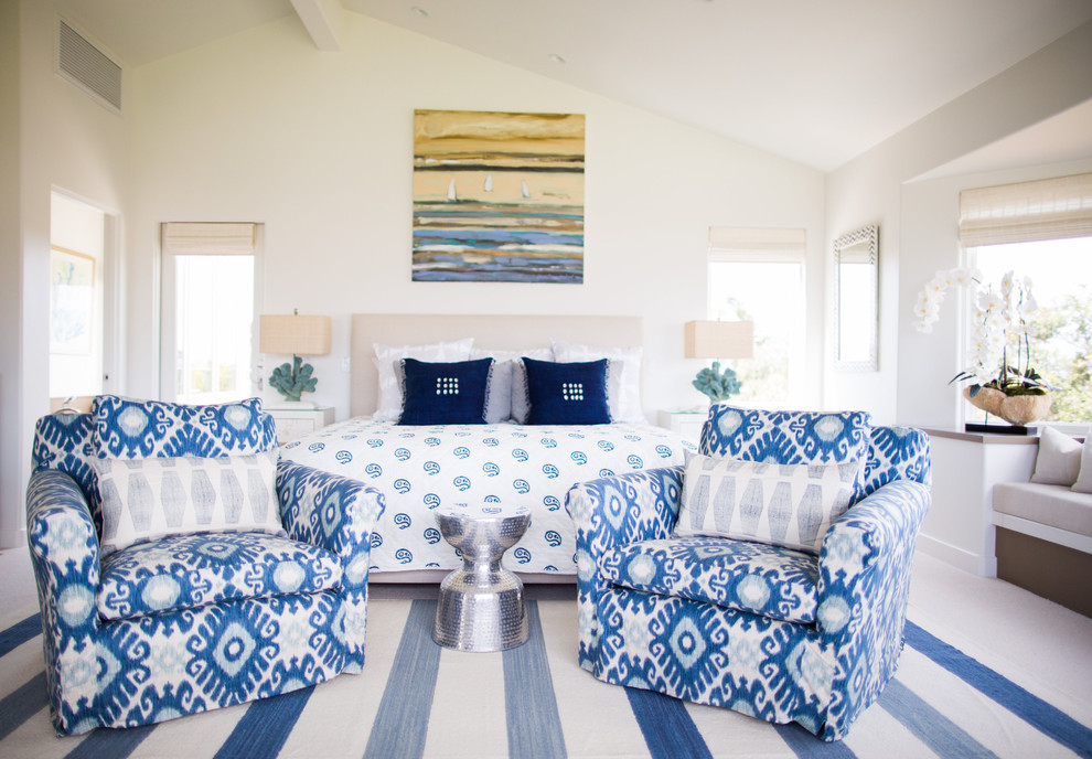 This is an example of a beach style bedroom in Santa Barbara with white walls and carpet.