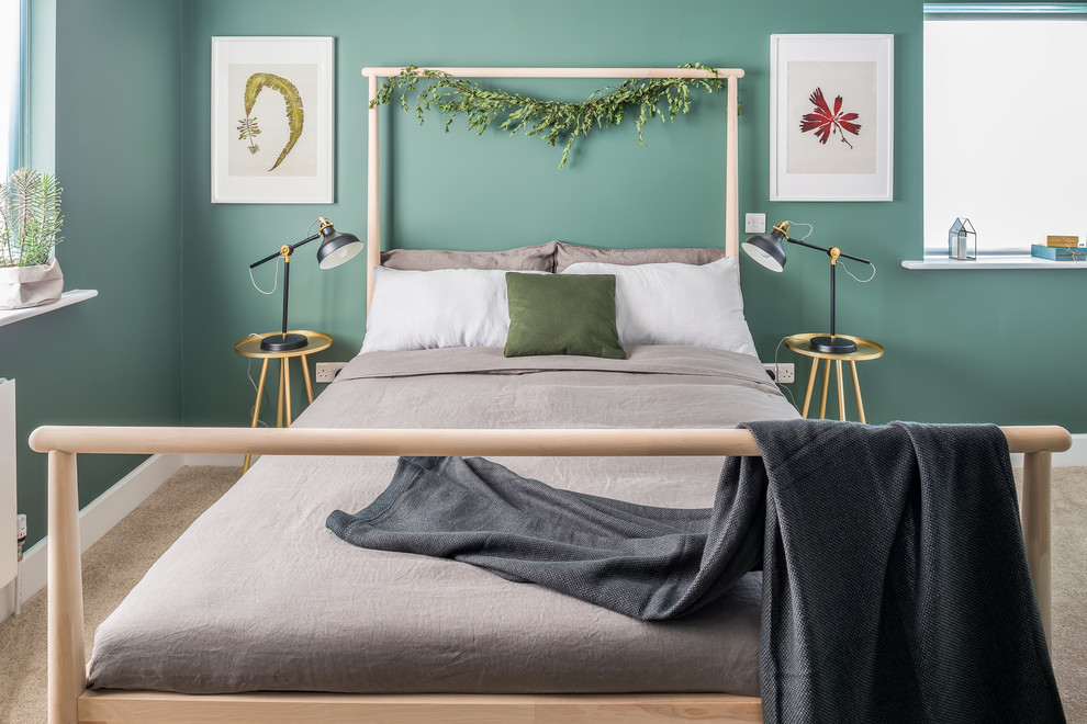 Example of a mid-sized danish carpeted and beige floor bedroom design in Dublin with green walls and no fireplace
