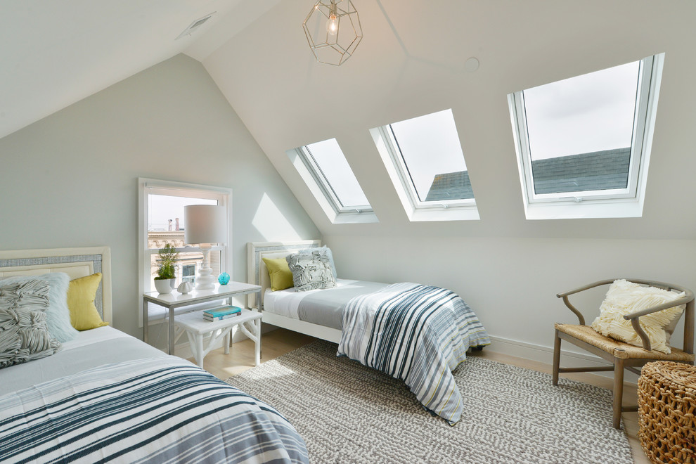 This is an example of a small contemporary guest loft bedroom in San Francisco with light hardwood flooring, multi-coloured walls and beige floors.