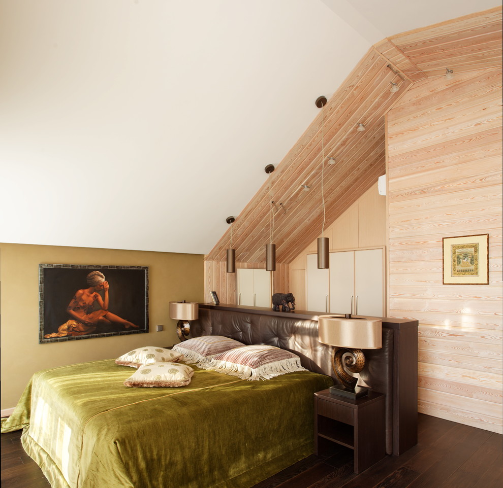 Inspiration for a contemporary bedroom in Moscow with dark hardwood flooring.