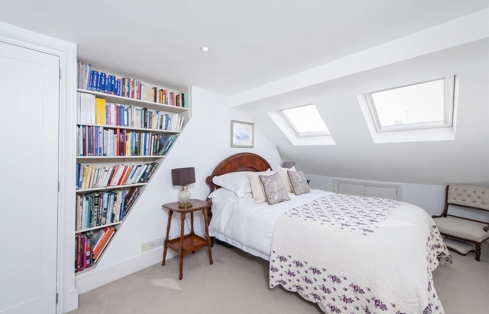 Elegant carpeted bedroom photo in London with white walls