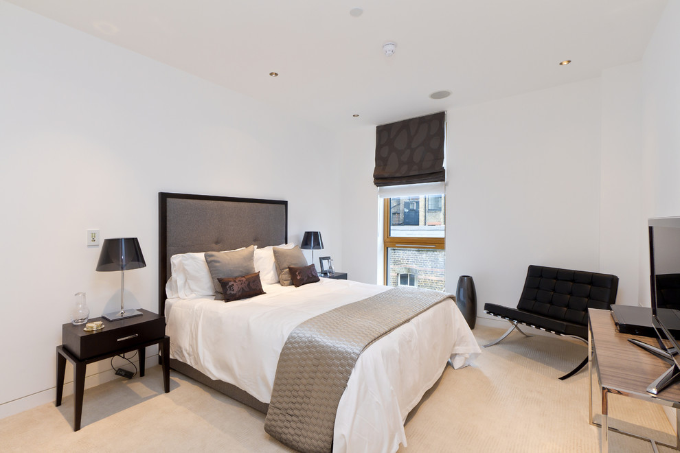 Example of a trendy bedroom design in London with white walls