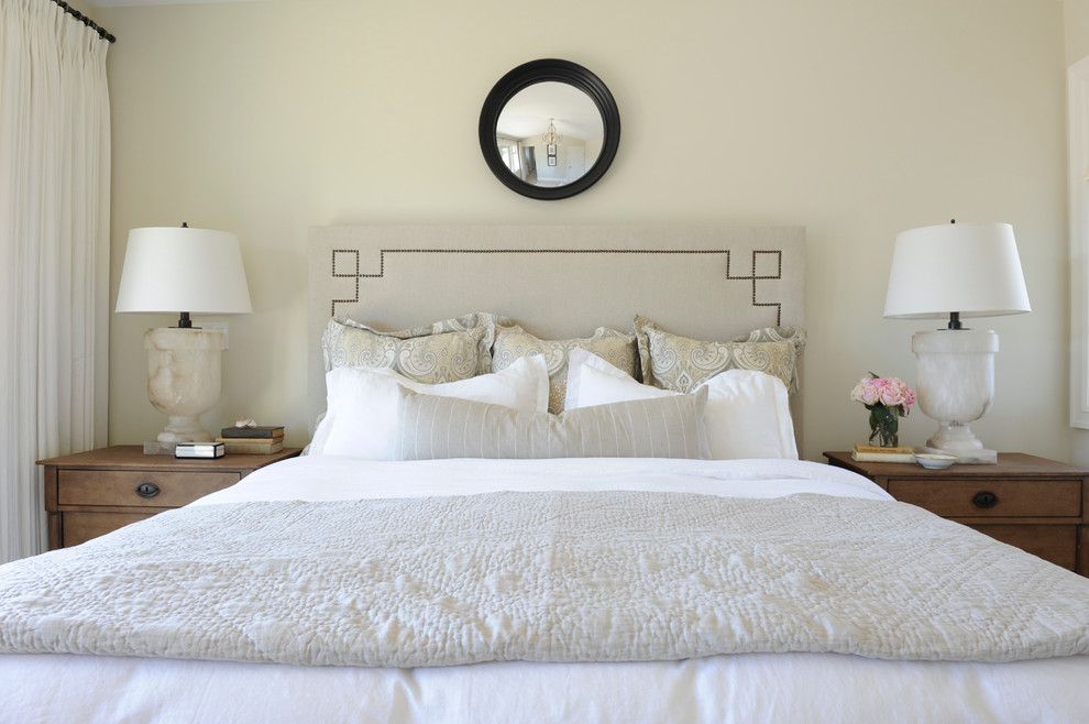 Inspiration for a timeless bedroom remodel in Vancouver with beige walls