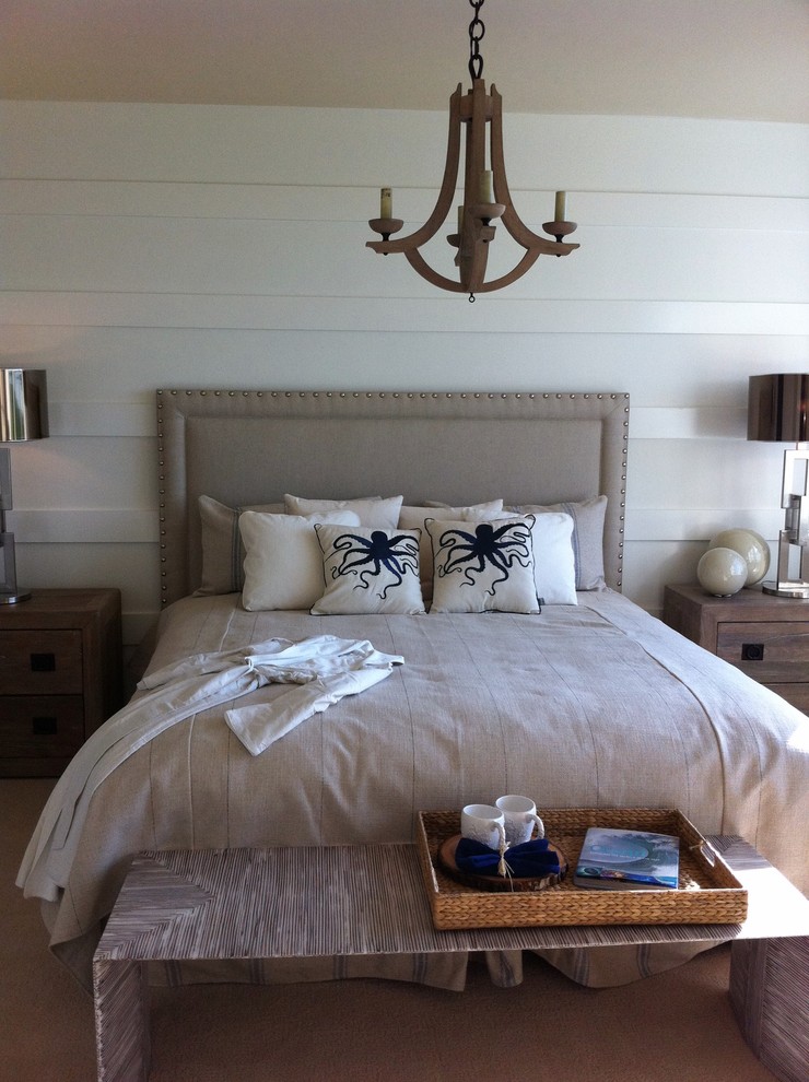 This is an example of a beach style bedroom in Miami with white walls.