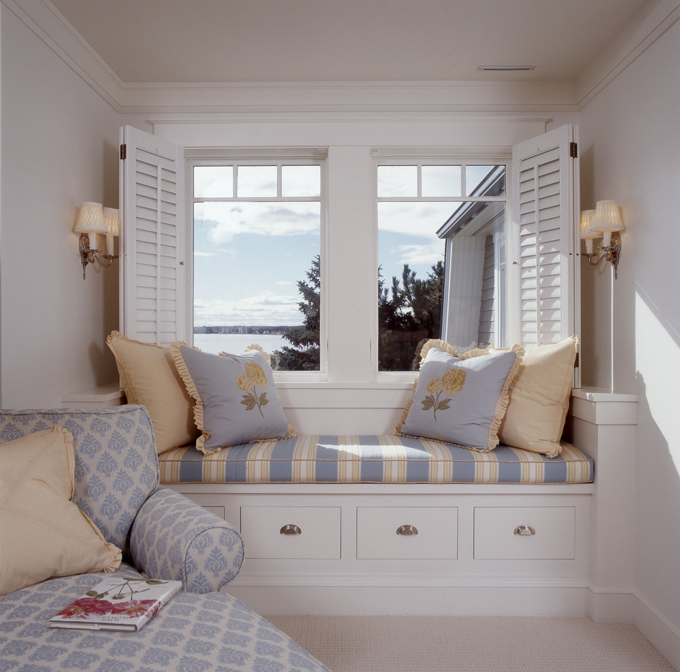 Design ideas for a coastal bedroom in Portland Maine with white walls and carpet.