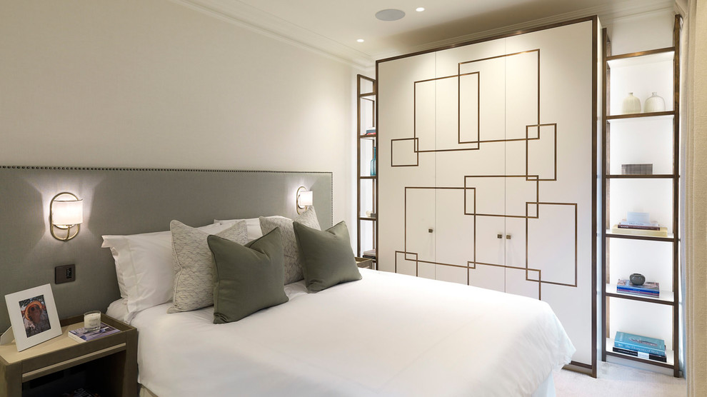 Mid-sized minimalist guest bedroom photo in London