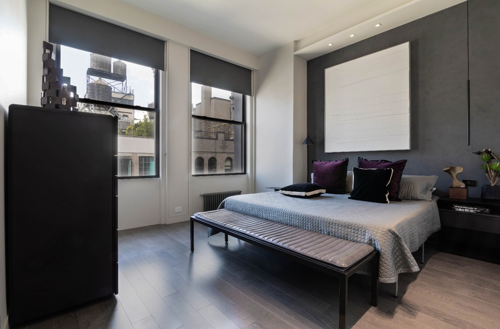 Inspiration for a modern guest bedroom in New York with white walls, dark hardwood flooring and grey floors.