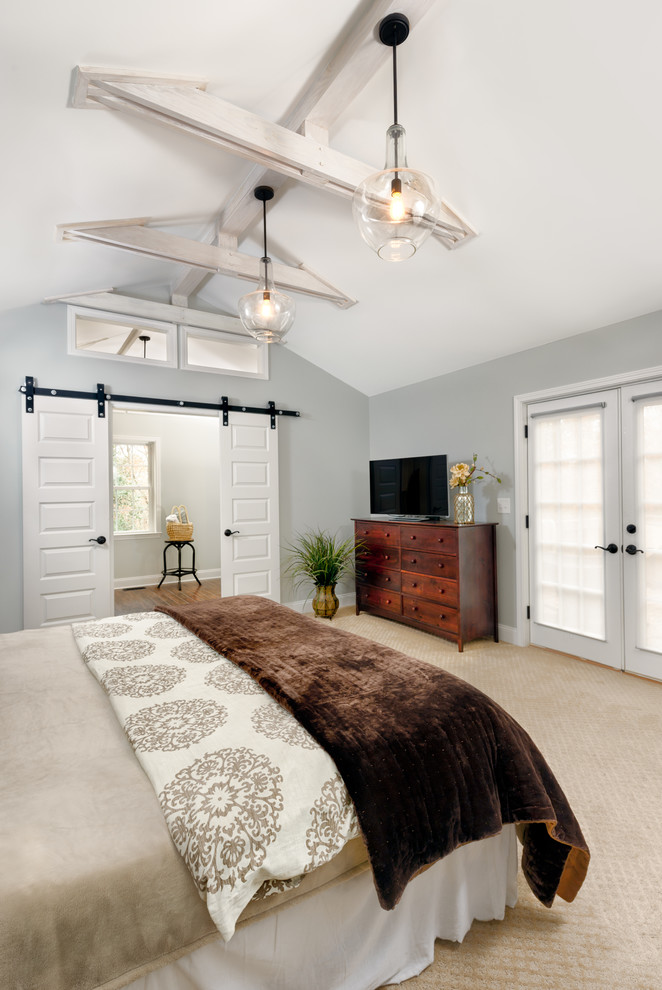 Inspiration for a large timeless master carpeted and beige floor bedroom remodel in Raleigh with gray walls and no fireplace
