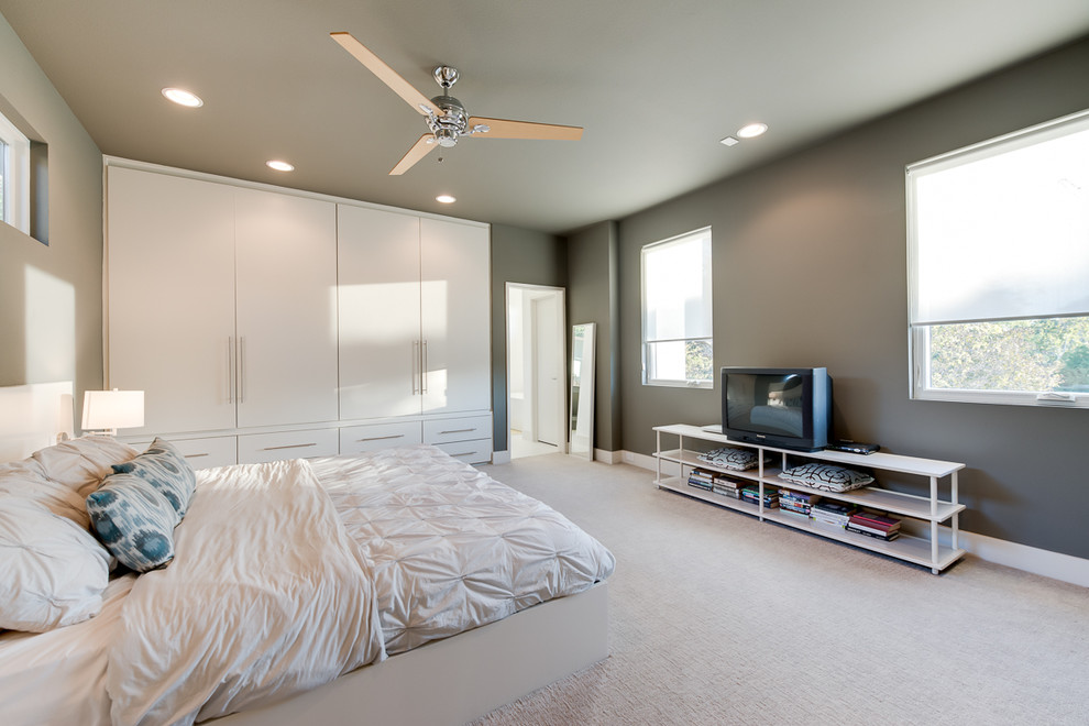 Contemporary bedroom in Dallas with grey walls.