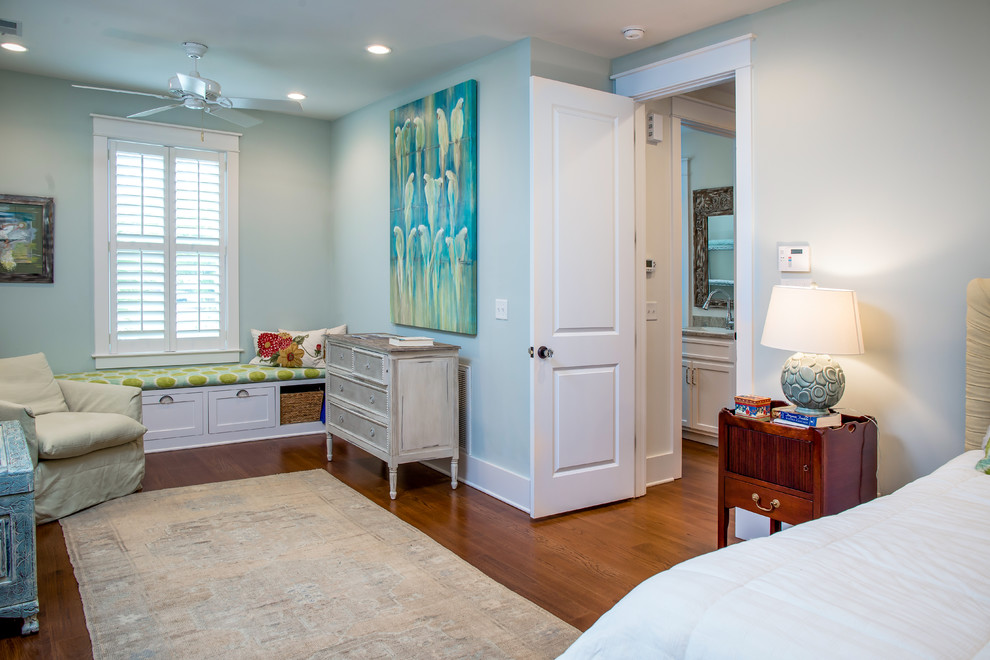 Photo of a large coastal bedroom in Charleston with medium hardwood flooring and no fireplace.