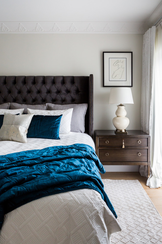 Inspiration for a large timeless master light wood floor bedroom remodel in Sydney with beige walls