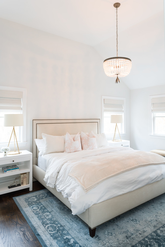 Medium sized beach style master bedroom in New York with blue walls and dark hardwood flooring.
