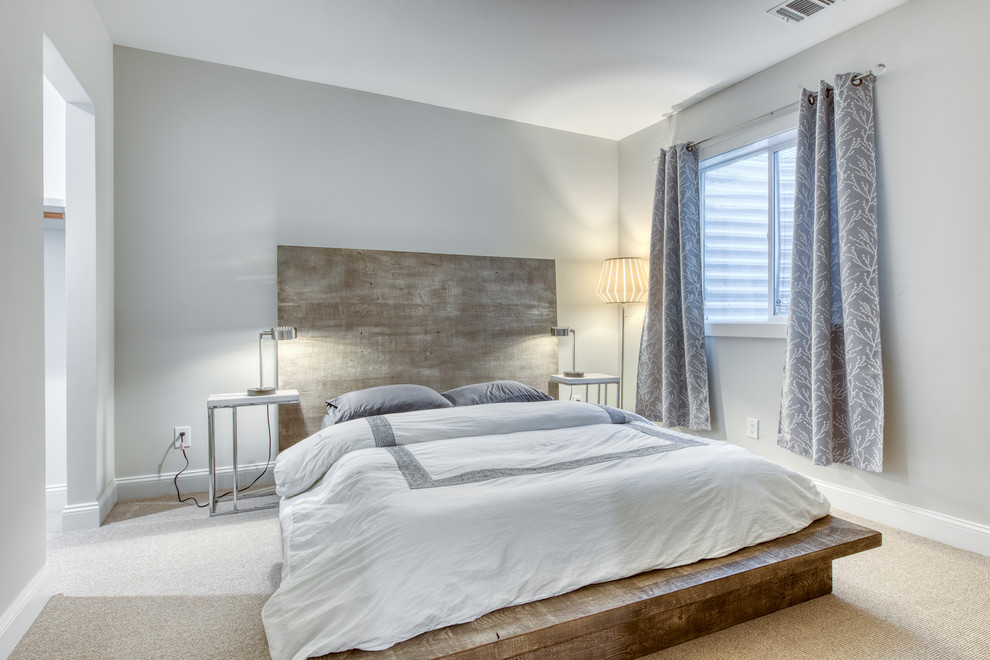 Photo of a medium sized modern guest bedroom in New York with grey walls, carpet, no fireplace and grey floors.