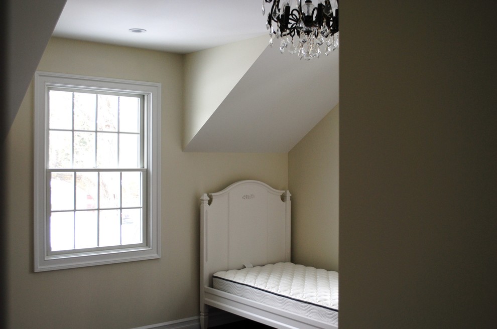 Example of a small classic guest dark wood floor bedroom design in New York with beige walls