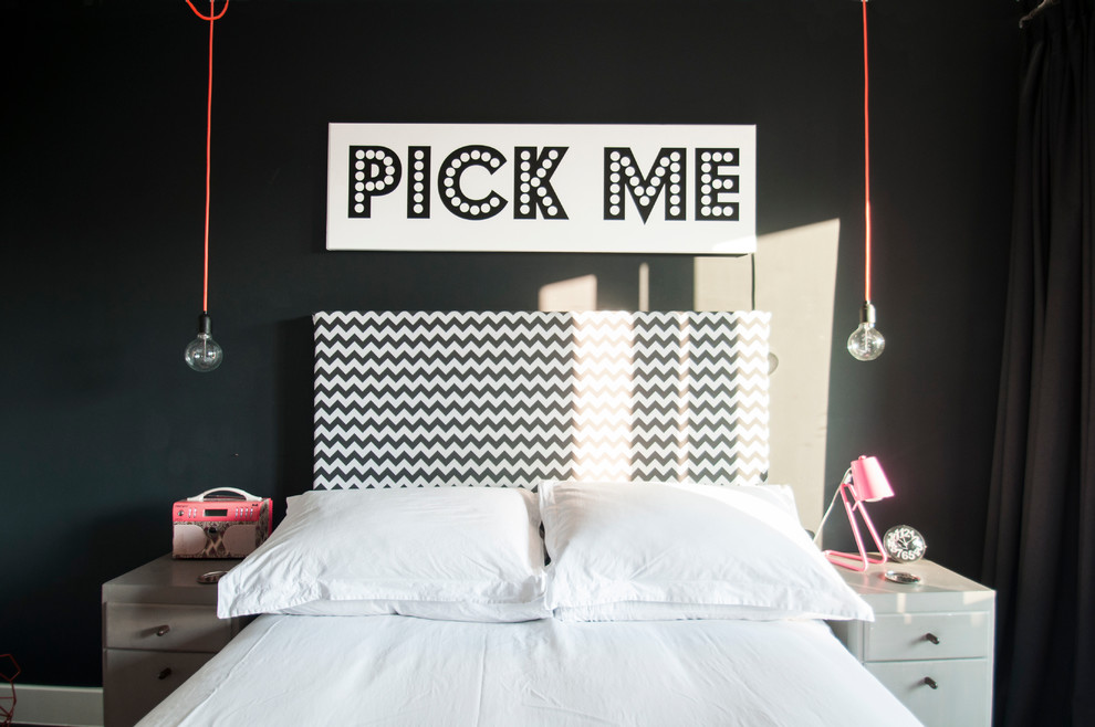 Inspiration for a small eclectic master bedroom remodel in London with black walls