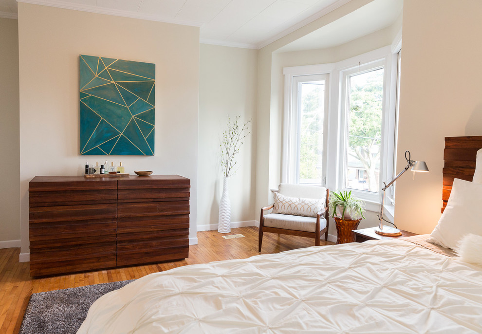 Inspiration for a medium sized contemporary guest bedroom in Toronto with light hardwood flooring and no fireplace.