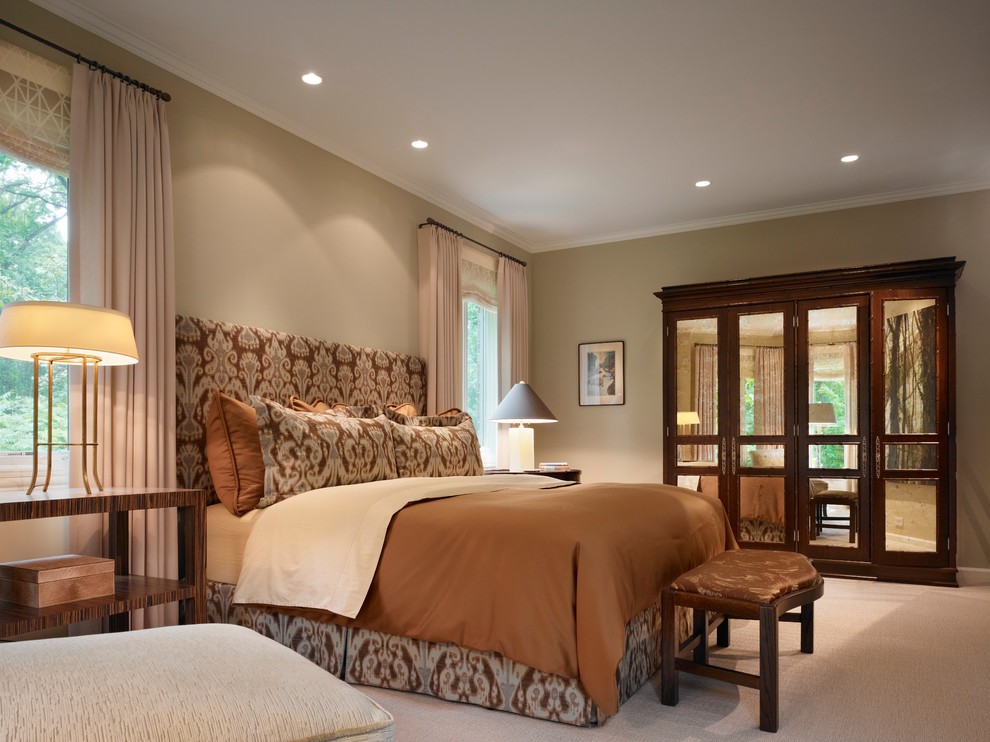 This is an example of a medium sized traditional master bedroom in Chicago with beige walls, carpet and no fireplace.