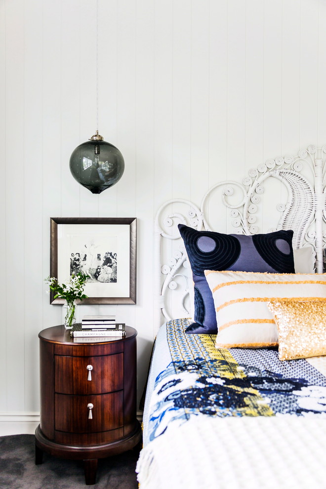 Inspiration for an eclectic bedroom in Melbourne with white walls and carpet.
