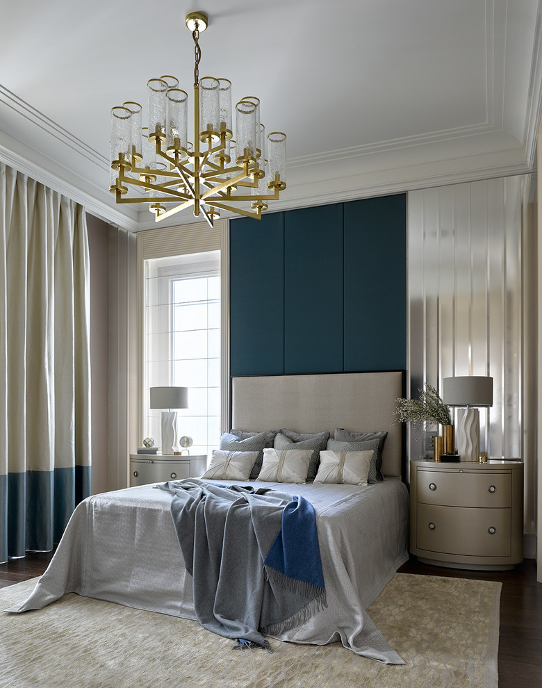 Design ideas for a traditional master and grey and teal bedroom in London with green walls, dark hardwood flooring and a feature wall.
