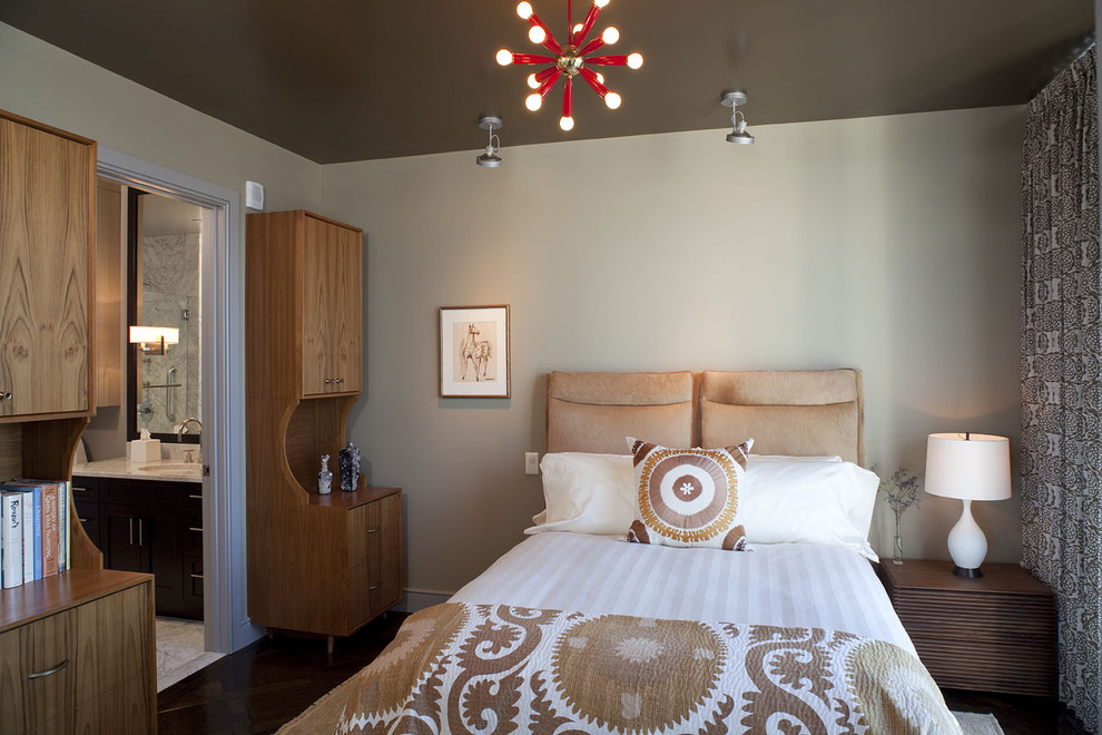 This is an example of an eclectic guest bedroom in Austin with beige walls.