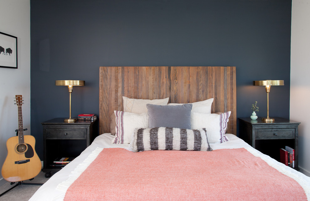 Eclectic grey and pink bedroom in San Francisco with blue walls, carpet and no fireplace.