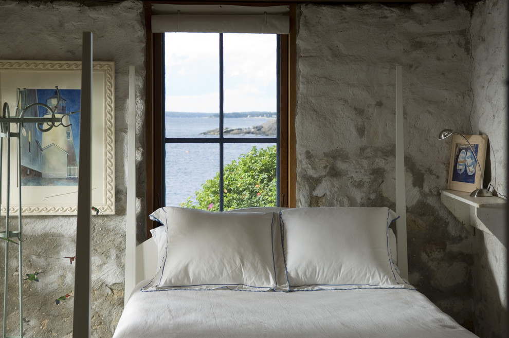 Example of a mountain style bedroom design with gray walls