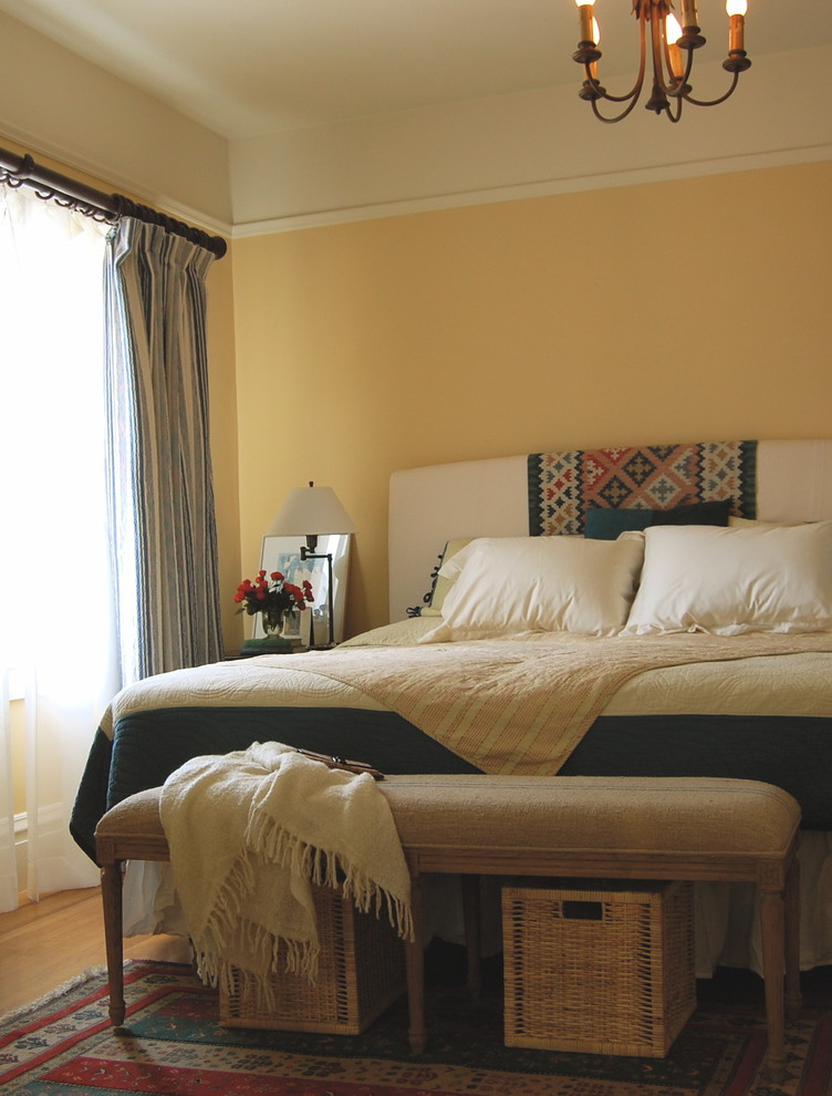 Inspiration for a bohemian bedroom in San Francisco with yellow walls.
