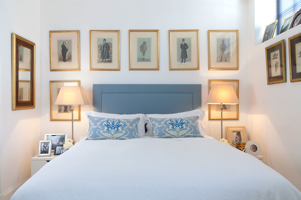 Elegant bedroom photo in London with white walls