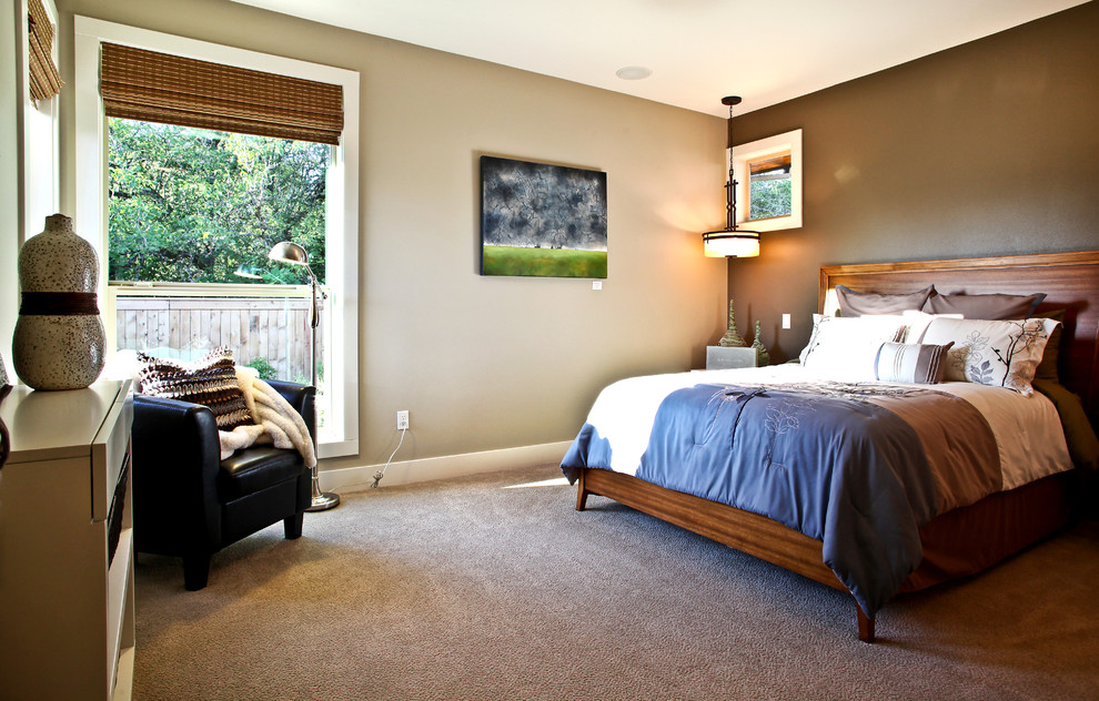 This is an example of a classic bedroom in Portland with beige walls, carpet and a feature wall.