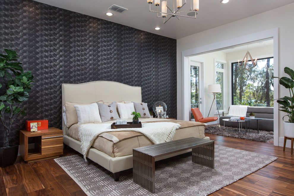 Photo of a contemporary master bedroom in Orlando with medium hardwood flooring and black walls.