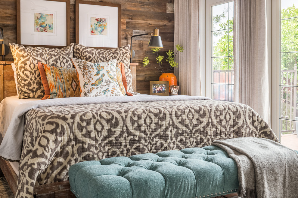 Inspiration for a small eclectic master medium tone wood floor bedroom remodel in San Diego with white walls
