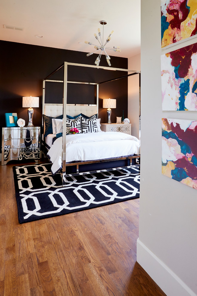 Inspiration for a medium sized eclectic guest bedroom in Dallas with black walls, dark hardwood flooring and no fireplace.