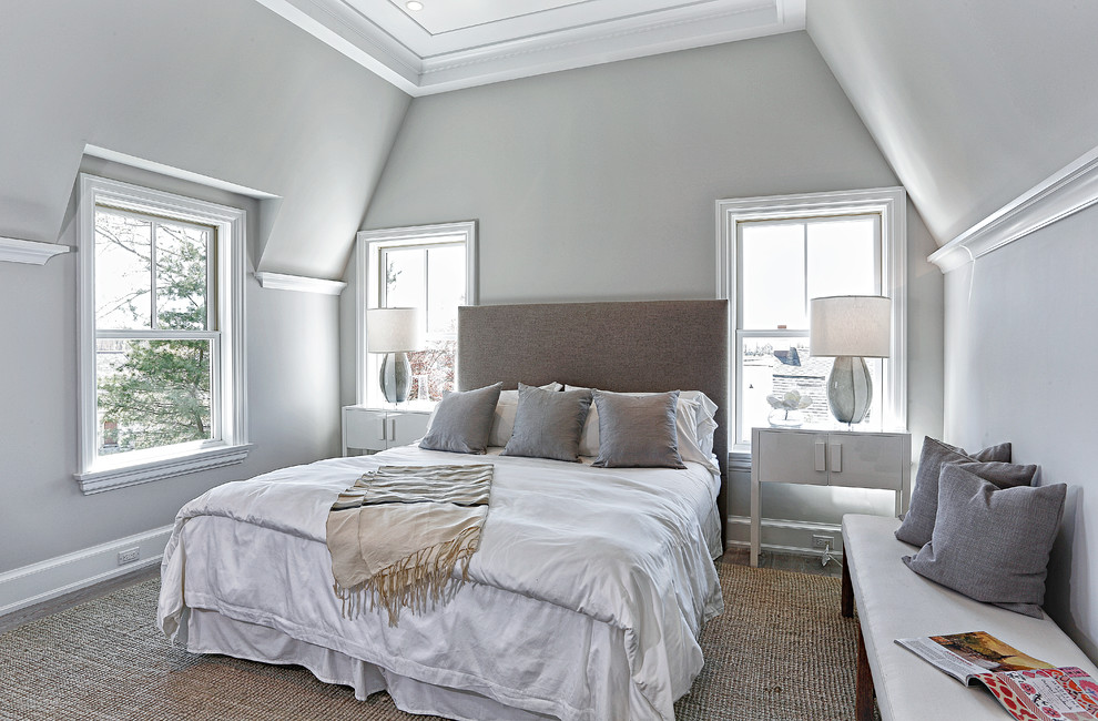 Mid-sized beach style master light wood floor and gray floor bedroom photo in New York with gray walls