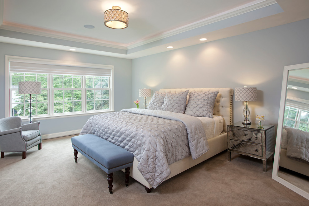 Expansive contemporary master bedroom in Minneapolis with grey walls and carpet.