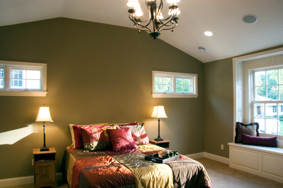 Photo of a large bohemian master bedroom in Minneapolis with green walls and carpet.