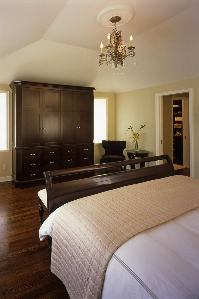 Photo of a large traditional master bedroom in Minneapolis with beige walls, dark hardwood flooring and no fireplace.