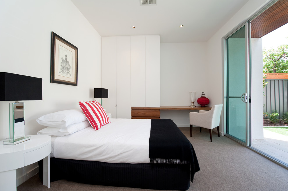Photo of a small contemporary master bedroom in Adelaide with white walls and carpet.