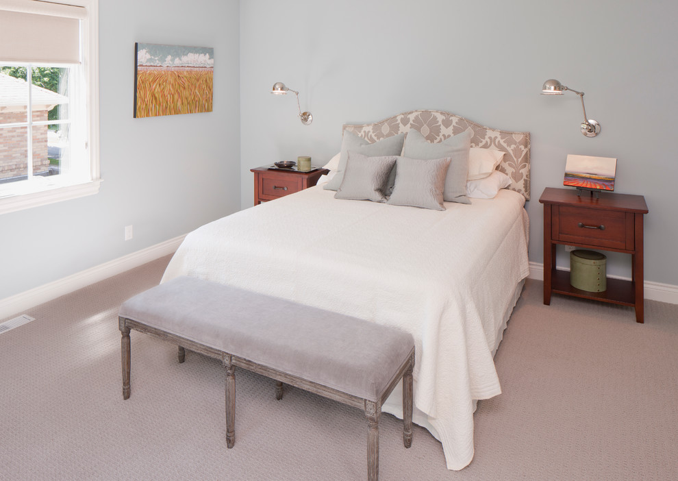 This is an example of a contemporary grey and silver bedroom in Grand Rapids with blue walls.