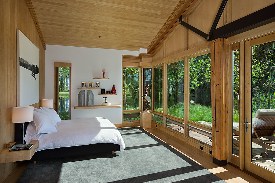 Inspiration for a mid-sized cottage light wood floor bedroom remodel in Other with white walls