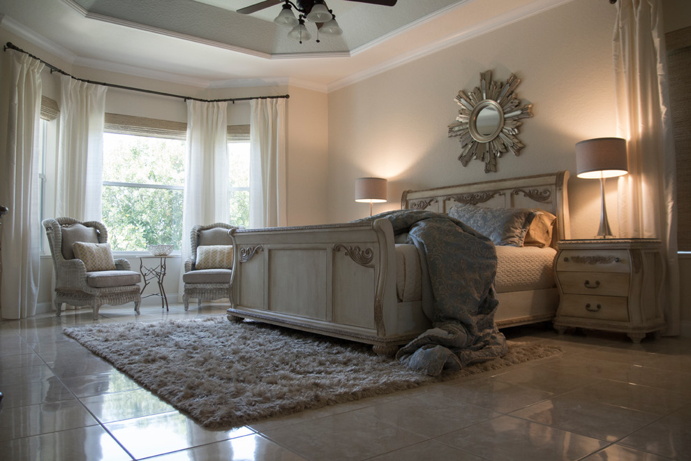 This is an example of a medium sized traditional master bedroom in Orlando with beige walls, porcelain flooring and no fireplace.