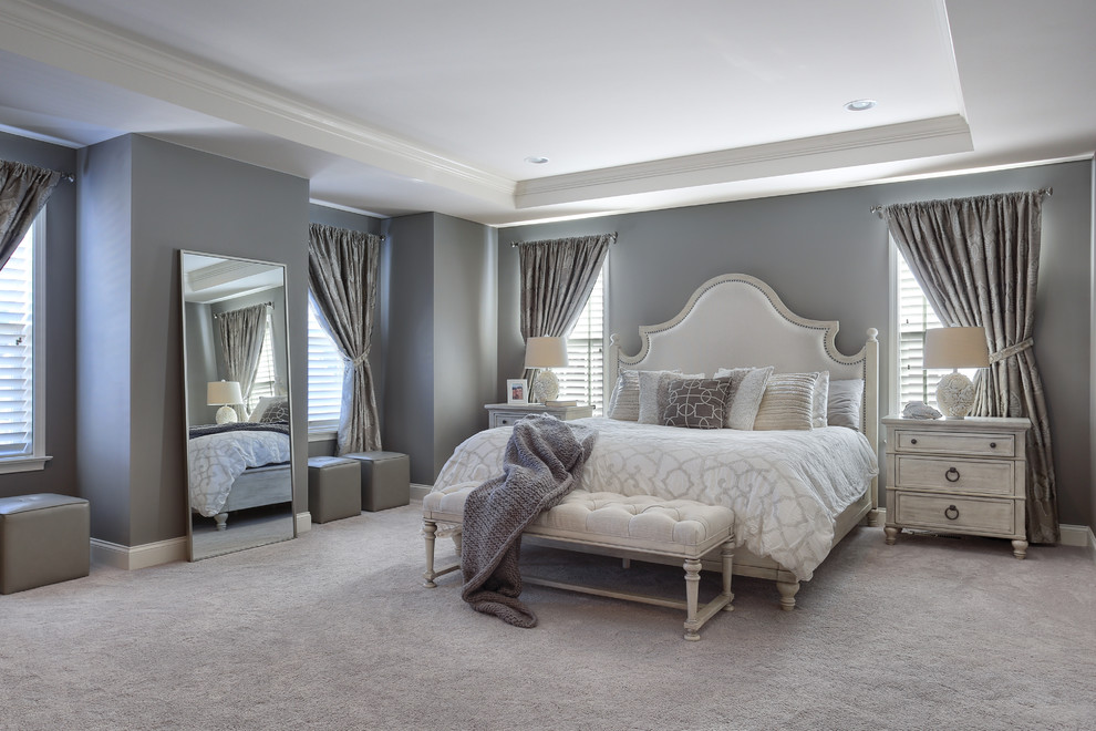 Example of a large transitional master carpeted and gray floor bedroom design in Other with gray walls and no fireplace