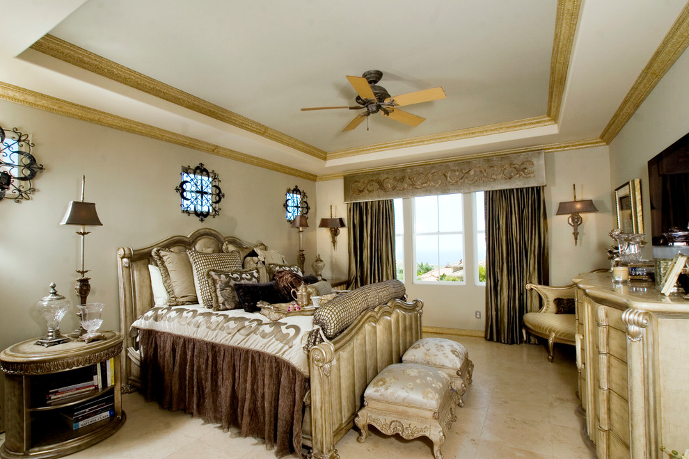 This is an example of a traditional master bedroom in Orange County with white walls, lino flooring and beige floors.