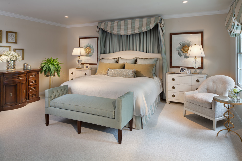 Photo of a traditional bedroom in DC Metro with grey walls and carpet.
