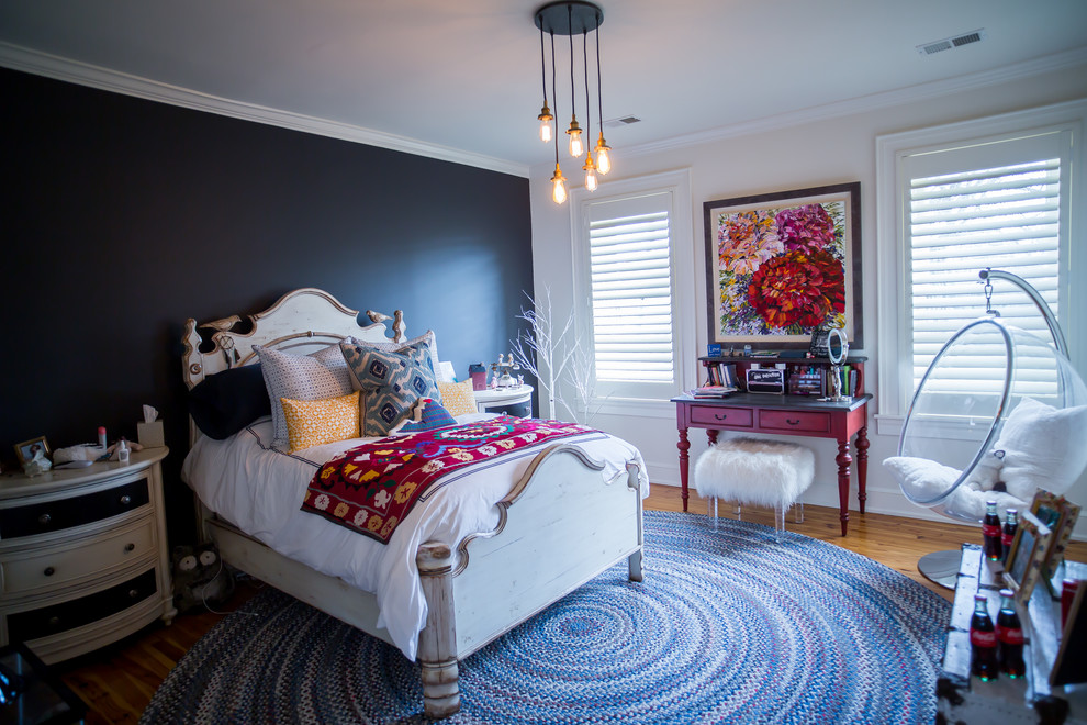 Inspiration for a mid-sized farmhouse guest light wood floor and brown floor bedroom remodel in DC Metro with blue walls and no fireplace