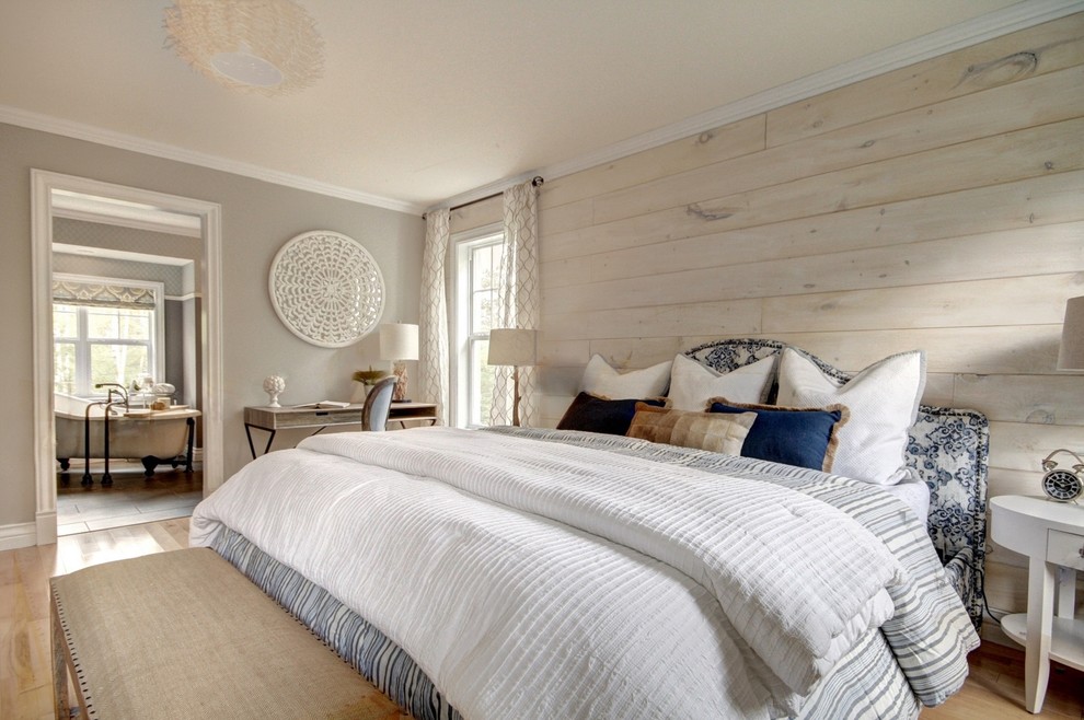 Inspiration for a mid-sized country master travertine floor and beige floor bedroom remodel in Other with gray walls and no fireplace